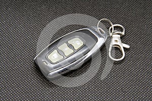 Car key chain. Car lock remote control in a key ring.