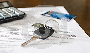 Car key, credit card on a signed sales contract