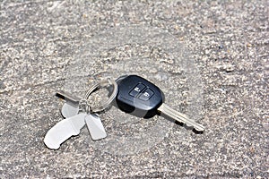 Car key drop on the road background. Car key lost on the road