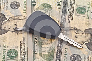 Car Key on Money Background