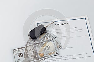 Car key, money and contract on a table. Car purchase or insurance concept