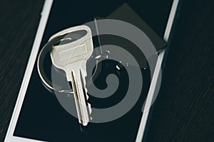 Car key with smartphone isolated on dark background.Key