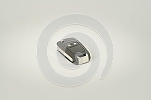 Car key on a white background. Perfect symbol to acquire a vehicle, to have property etc