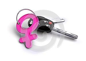 Car keys with female icon keyring. Concept for women drivers or car owners photo