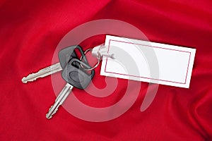 Car Keys and gift card on red