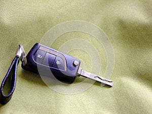 Car Keys on greenish Textile Background