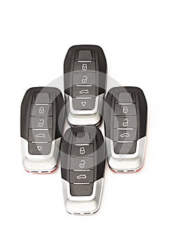 Car keys lie in different poses on a white background.