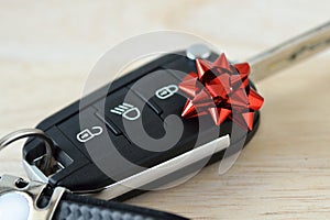 Car keys with red gift bow - Concept of new car gift