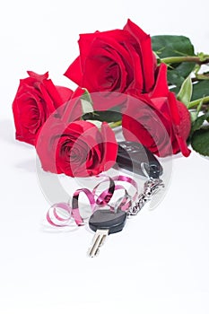 Car keys and roses bouquet