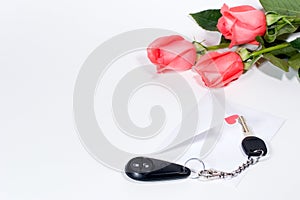 Car keys and roses bouquet present