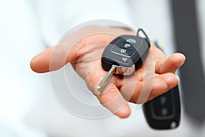 Car Keys. Seller hand giving keys photo