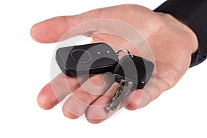 Car Keys. Seller hand giving keys on white