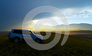 Car in landscape with Light from the sky and