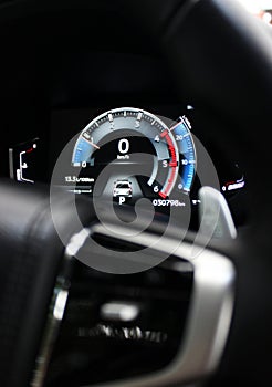 Car LED dashboard display with engine revolutions, speed, temperature, fuel level, fuel consumption and mileage photo