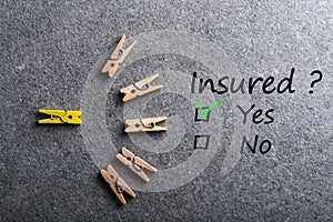 Car, life insurance, home, travel and healt insurance. Insure concept. Survey with question Insured, Yes or no.