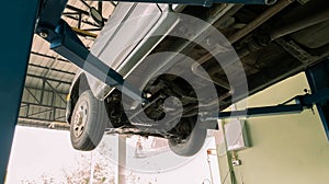 Car lifted in Manual pickup truck at service  center for fixing repairs change engine oil