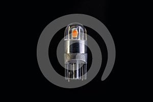 Car light bulb emitting diode, accessories and components for electronics vehicles. copy space. Black background close-up. 12V T10