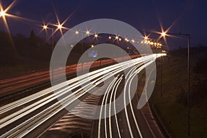 Car light rails on the M1 in England, UK.