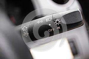 Car light switch control paddle.