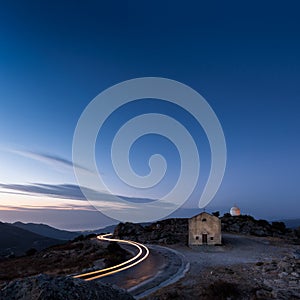 Car light trail around San Sebastiano chapel near Palasca in Cor