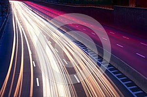 Car light trails on the city street at night