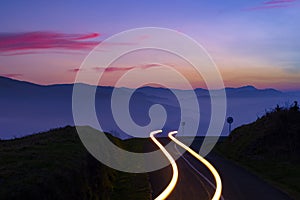 Car Light Trails on mountain road at night