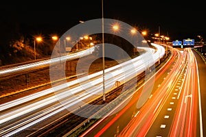 Car lights at a highway at night