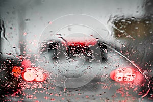 Car lights through the wet windshield