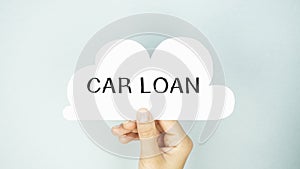 Car Loan. Businessman holding a card with a message