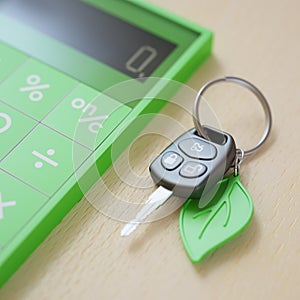 Car loan calculation concept with car keys photo