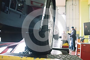 Car maintenance in mechanical workshop photo