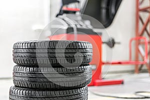 Car maintenance and service center. Vehicle tire repair and replacement equipment. Seasonal tire change