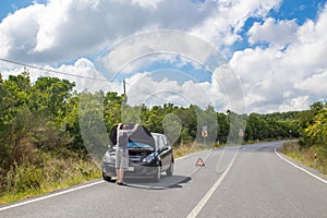 Car malfunction on countryside. Car waiting for help on the road. Car breakdown. Man with car breakdown, phone calling with help