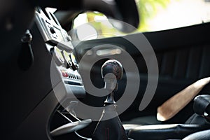 Car manual leather gear lever knob. Close up shot, selective focus, no people, generic car