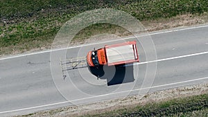 Car marks dividing lines on a new road.