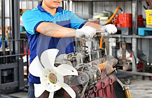 car mechanic in auto repair service in automobile garage