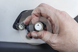 Car mechanic changes the parking sensor on the car, the sensor malfunction of parking sensors
