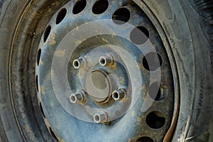 Car mechanic changing car wheel and tire by wrench at car garage in Bucharest, Romania, 2021