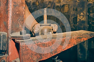 Car Mechanic Check Shock Absorber and Maintenance in Vintage Tone