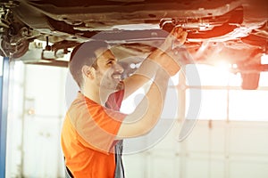 Car mechanic fixing a car