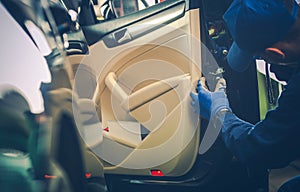 Car Mechanic Fixing Door Lock