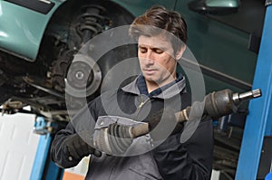 Car mechanic / repairman is working