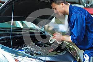 Car mechanic working on a car