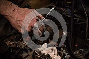 Car mechanic working on the engine