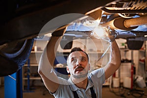 Car Mechanic Working in Garage