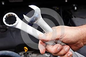 Car mechanic with wrench.