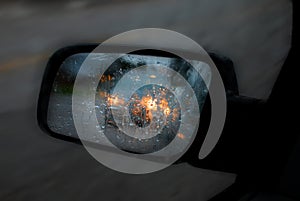 Car Mirror in Rain and Traffic