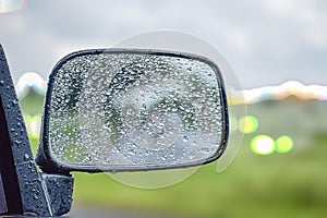 CAR Mirror Window glass ON THE GO -TRAVELLING with condensation of natural water drops. Abstract photo