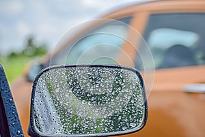 CAR Mirror Window glass ON THE GO -TRAVELLING with condensation of natural water drops. Abstract photo