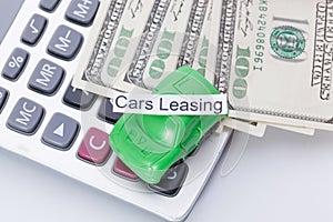 Car money and calculator With sign - Cars Leasing. Payments and costs.